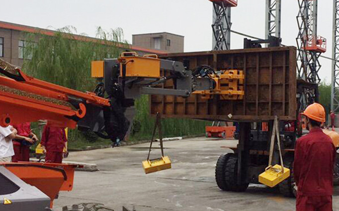 Lifting concrete forms with battery powered steel handling magnets on a boom lift crane, HVR MAG