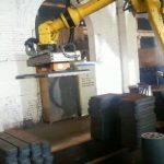 Machine tending robot transferring steel workpiece with magnetic gripper - HVR MAG