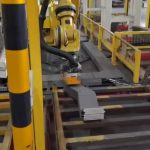Magnetic robot gripper palletizing the bent strip