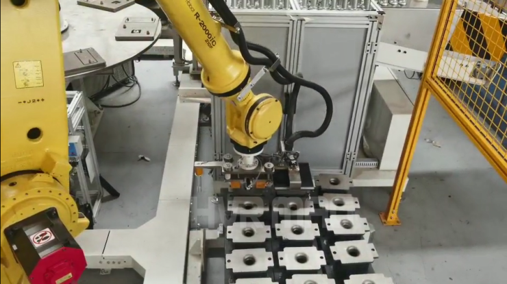 Automatic handling of car absorbers with magnetic grippers